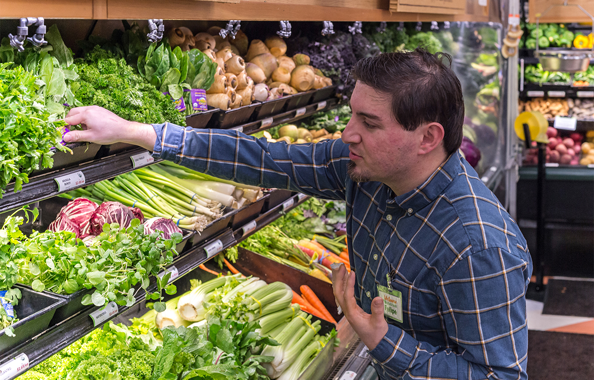 Felipe has difficulty shopping produce because he injured his finger.