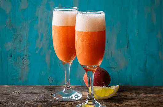 Sparkling Peach Lemonade in Tall Glasses