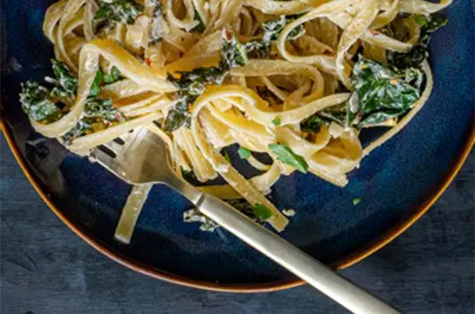Pasta With Kale Strips, and Creamy Vegan Lemon-Garlic Sauce