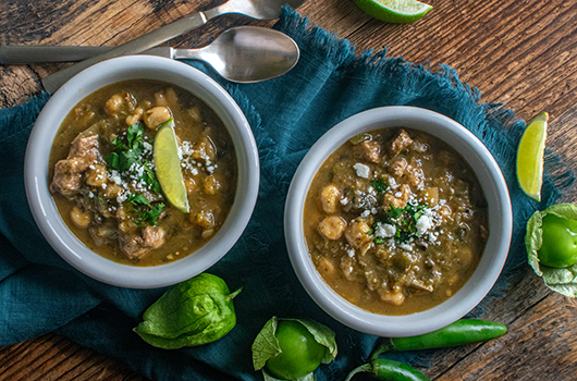 Pozole Verde in soup bowls on the serving tray
