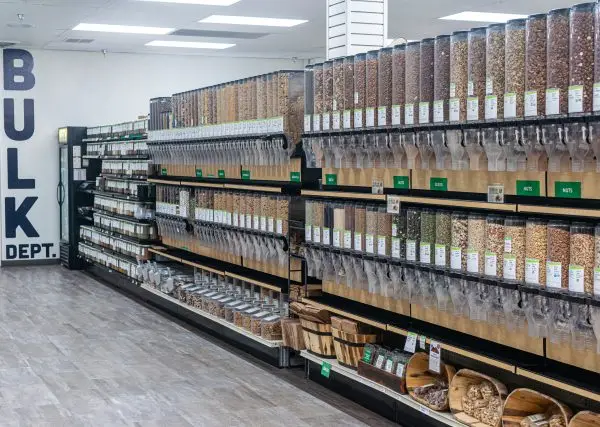 LifeSource bulk department. Bins of nuts, candy, trail mix, snacks, and refrigerated bulk items.