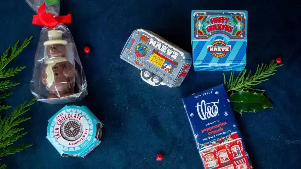 Stocking stuffers for chocolate lovers. Chocolate snowman, Taza mexican style ground dark chocolate, Maeve chocolate bon bons, Theo fair trade organic peppermint crunch, 70% dark chocolate. Maeve Happy Holidays chocolate bon bons.