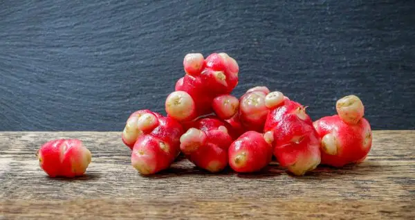 pink and white root vegetable, Oca