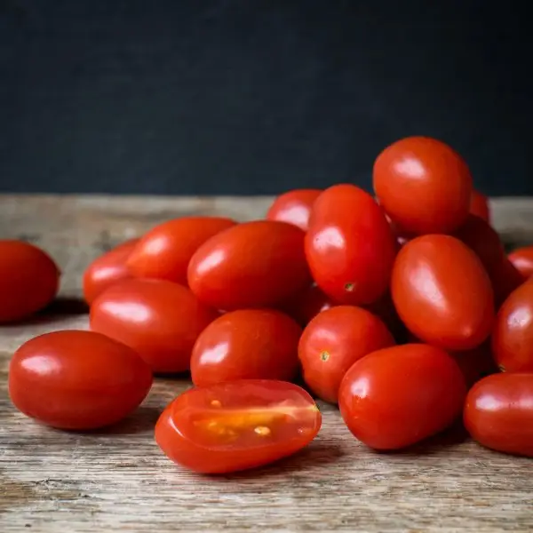Pile of small red Gabrielle grape tomatoes