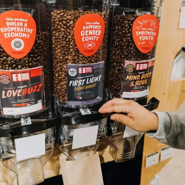 Person getting coffee from the bulk department