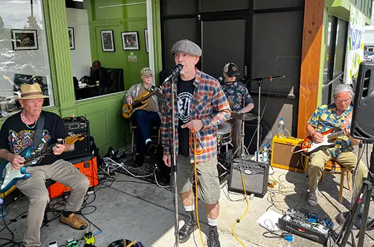 Live band The Gusto Brothers performing outside LifeSource Natural Foods during Food Fair.