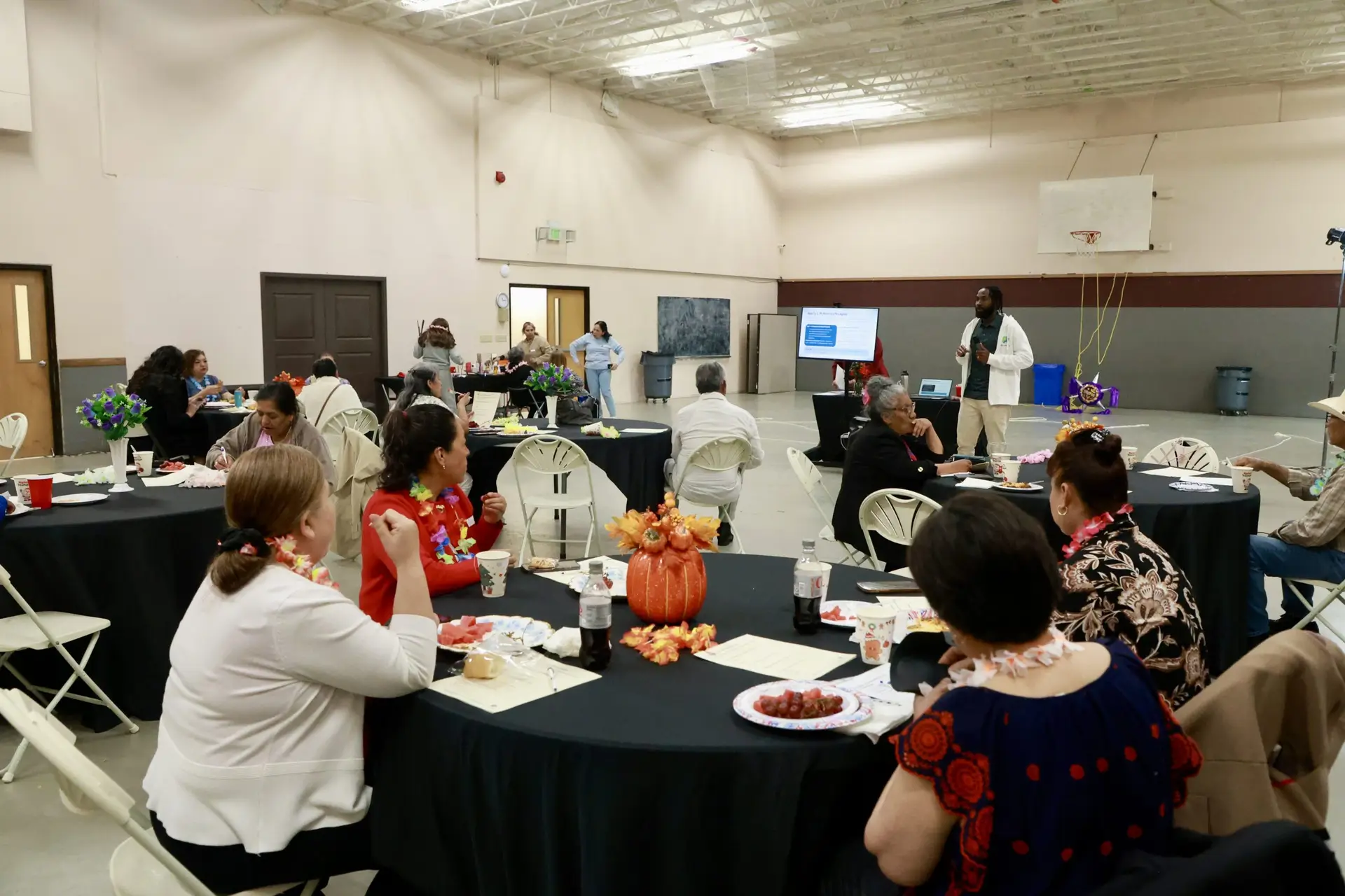 People gathered for a presentation and lunch.